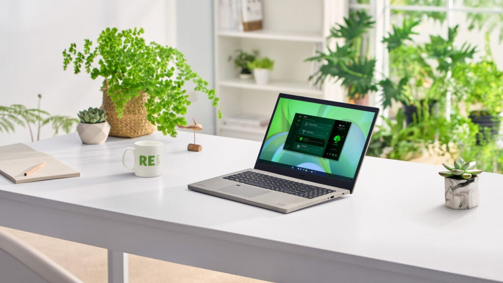 Professionele ondernemer werkt ontspannen met Acer-laptop in lichte kantoorruimte – WorkOnCapital leasing